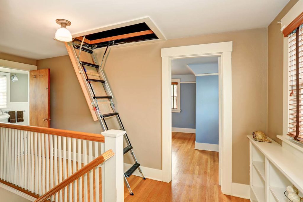 A staircase with a ladder in the middle of it.